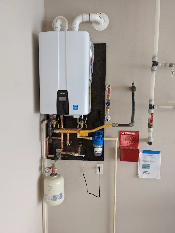 Professional plumber installing copper piping in a Pocomoke City home